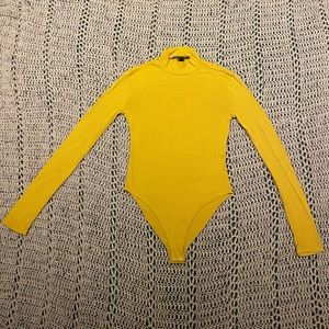 Yellow bodysuit.